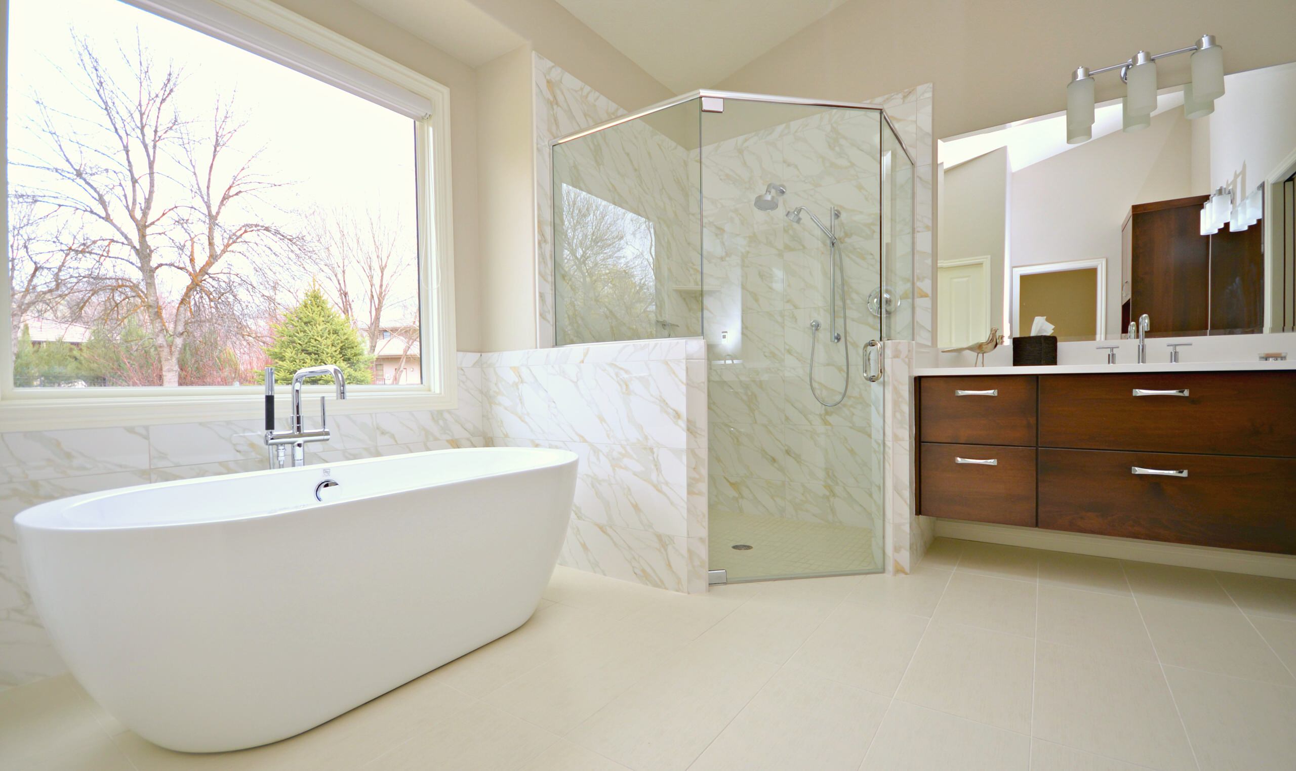 Carrara porcelain shower and wainscot